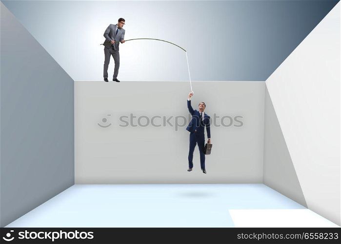 The businessman fishing his colleague in business concept. Businessman fishing his colleague in business concept. The businessman fishing his colleague in business concept