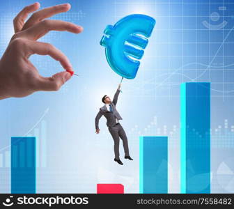 The businessman flying on euro sign inflatable balloon. Businessman flying on euro sign inflatable balloon