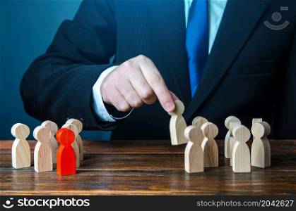 The businessman gathers a team of candidates. Staff and Human Resource Management. Team building. Employment. Personnel selection. Staffing, recruiting and training workers. Appointment to posts