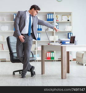 The businessman having fun taking a break in the office at work. Businessman having fun taking a break in the office at work