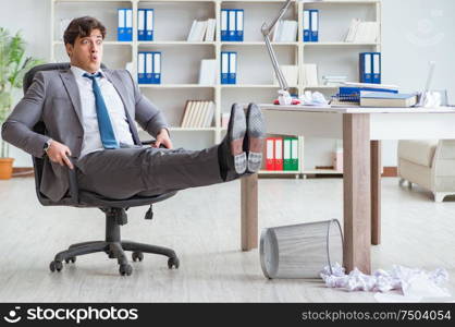 The businessman having fun taking a break in the office at work. Businessman having fun taking a break in the office at work