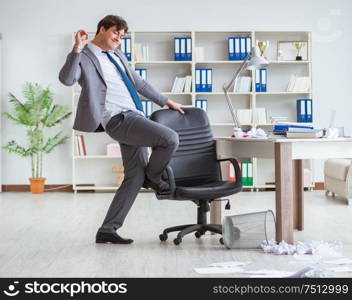 The businessman having fun taking a break in the office at work. Businessman having fun taking a break in the office at work