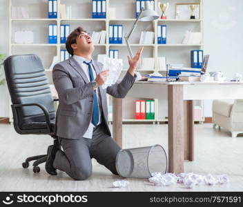 The businessman having fun taking a break in the office at work. Businessman having fun taking a break in the office at work