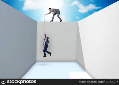 The businessman helping colleague to escape from problems. Businessman helping colleague to escape from problems. The businessman helping colleague to escape from problems