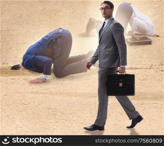 The businessman hiding his head in sand escaping from problems. Businessman hiding his head in sand escaping from problems