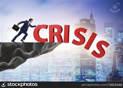 The businessman in crisis management concept. Businessman in crisis management concept
