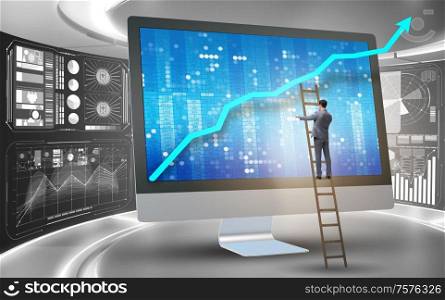 The businessman in economic forecasting concept with charts. Businessman in economic forecasting concept with charts