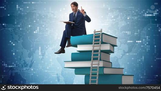 The businessman in education and learning concept. Businessman in education and learning concept