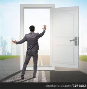 The businessman in front of door in business opportunities concept. Businessman in front of door in business opportunities concept