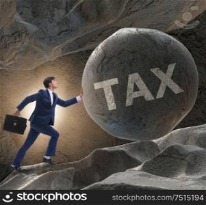 The businessman in high taxes business concept. Businessman in high taxes business concept
