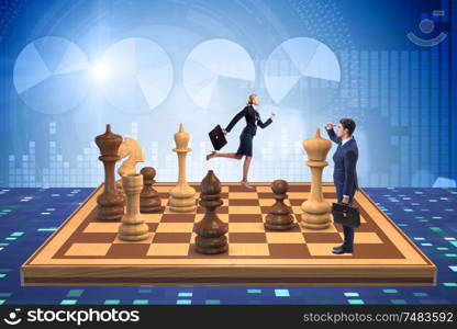 The businessman in large chess board in strategy concept. Businessman in large chess board in strategy concept