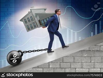 The businessman in mortgage debt financing concept. Businessman in mortgage debt financing concept