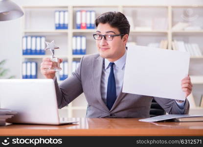 The businessman in office holding a blank message board. Businessman in office holding a blank message board