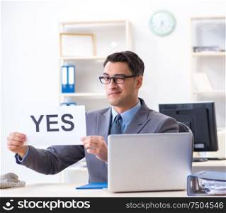 The businessman in positive yes answer in the office. Businessman in positive yes answer in the office