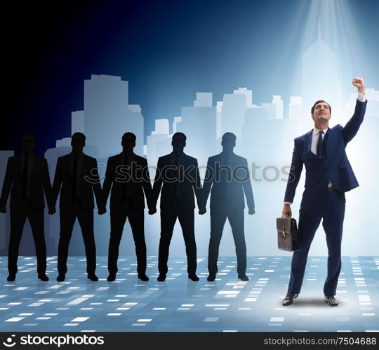 The businessman in the spotlight in business concept. Businessman in the spotlight in business concept