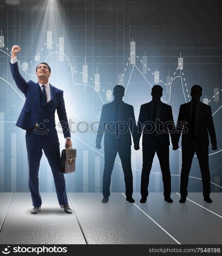 The businessman in the spotlight in business concept. Businessman in the spotlight in business concept
