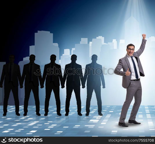 The businessman in the spotlight in business concept. Businessman in the spotlight in business concept