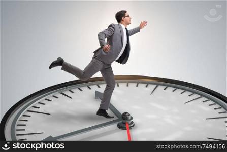The businessman in time management concept. Businessman in time management concept
