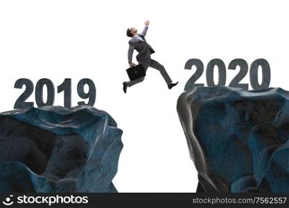 The businessman jumping from year 2019 to 2020. Businessman jumping from year 2019 to 2020