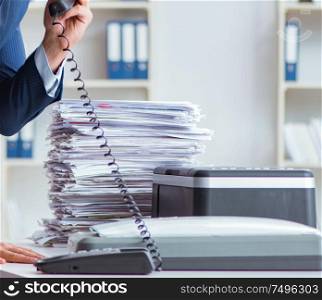 The businessman making copies in copying machine. Businessman making copies in copying machine
