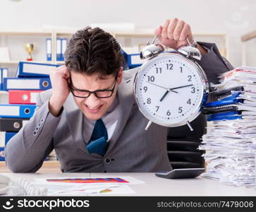 The businessman missing deadlines due to excessive work. Businessman missing deadlines due to excessive work