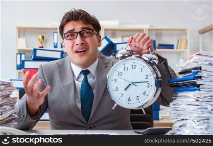 The businessman missing deadlines due to excessive work. Businessman missing deadlines due to excessive work