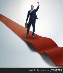 The businessman on the red carpet in success concept. Businessman on the red carpet in success concept