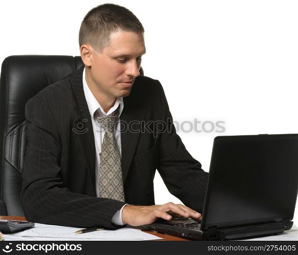 The businessman on the workplace. It is isolated on a white background