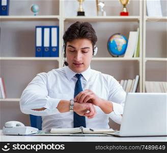 The businessman operator traveling agent working in the office. Businessman operator traveling agent working in the office