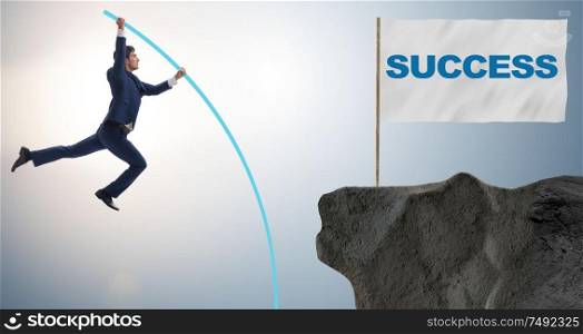 The businessman pole vaulting towards his success goal. Businessman pole vaulting towards his success goal