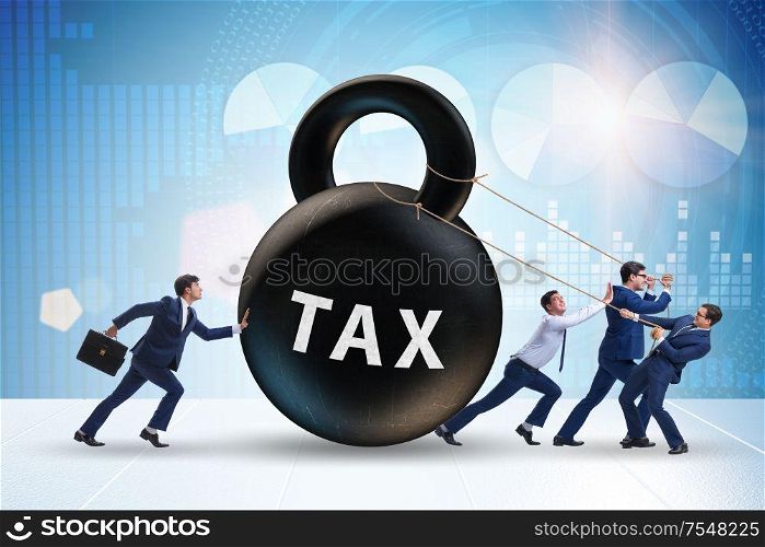 The businessman pulling kettlebell in tax concept. Businessman pulling kettlebell in tax concept