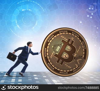 The businessman pushing bitcoin in cryptocurrency blockchain concept. Businessman pushing bitcoin in cryptocurrency blockchain concept