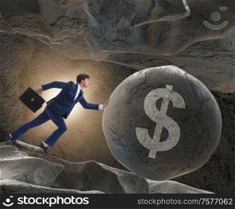 The businessman pushing dollar sign in business concept. Businessman pushing dollar sign in business concept