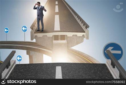 The businessman ready to overcome the broken bridge. Businessman ready to overcome the broken bridge
