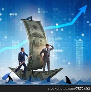 The businessman rowing on dollar boat in business financial concept. Businessman rowing on dollar boat in business financial concept