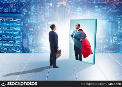 The businessman seeing himself in mirror as superhero. Businessman seeing himself in mirror as superhero