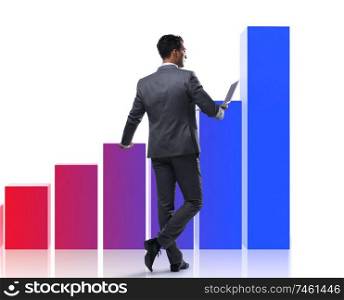 The businessman standing next to bar chart on white background. Businessman standing next to bar chart on white background