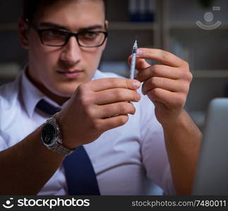 The businessman staying late in office for drugs. Businessman staying late in office for drugs