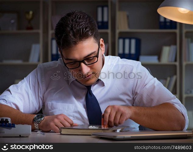 The businessman staying late in office for drugs. Businessman staying late in office for drugs