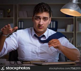 The businessman staying late in office for drugs. Businessman staying late in office for drugs
