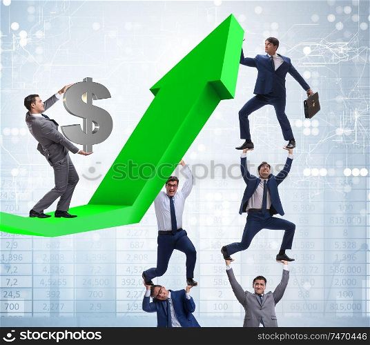 The businessman supporting growtn in economy on chart graph. Businessman supporting growtn in economy on chart graph