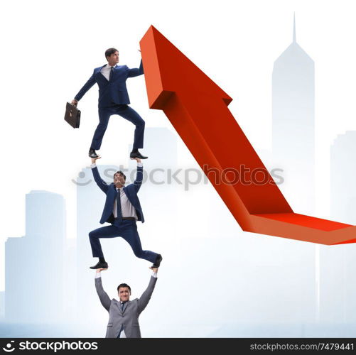 The businessman supporting growtn in economy on chart graph. Businessman supporting growtn in economy on chart graph