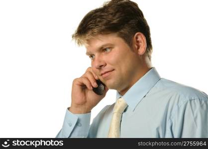 The businessman talking by a mobile phone. Young the man of the European appearance