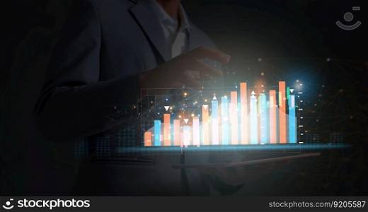 The businessman trader investor analyst uses the mobile phone app analytics to analyze cryptocurrency financial market data, trading data index charts, and graphs on a laptop and a smartphone. 