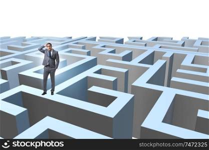 The businessman trying to escape from maze . Businessman trying to escape from maze