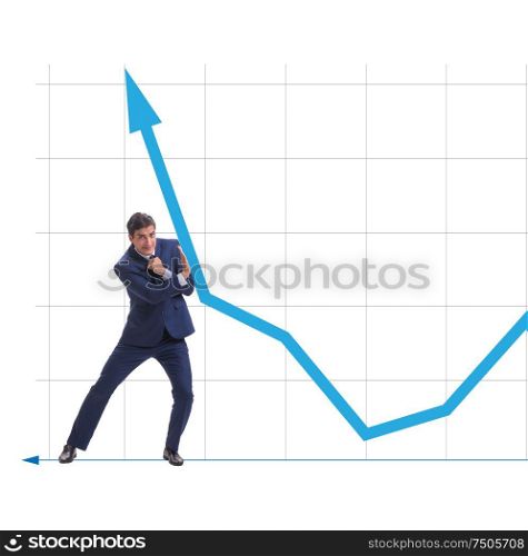 The businessman trying to help economic growth in business concept. Businessman trying to help economic growth in business concept