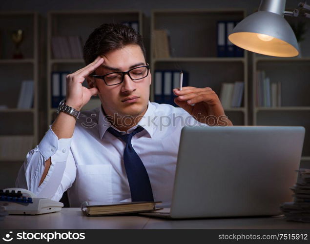 The businessman under stress smoking in office. Businessman under stress smoking in office