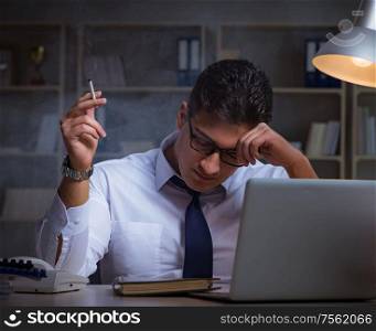 The businessman under stress smoking in office. Businessman under stress smoking in office