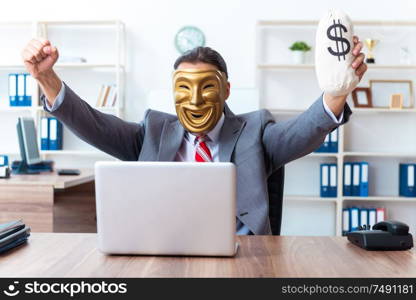 The businessman wearing mask in hypocrisy concept. Businessman wearing mask in hypocrisy concept