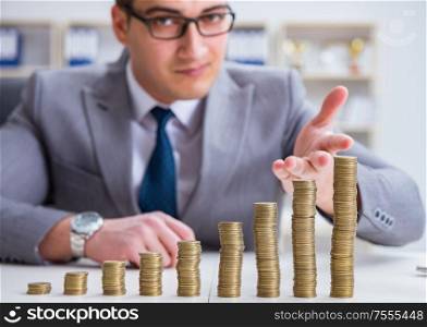 The businessman with golden coins in business growth concept. Businessman with golden coins in business growth concept